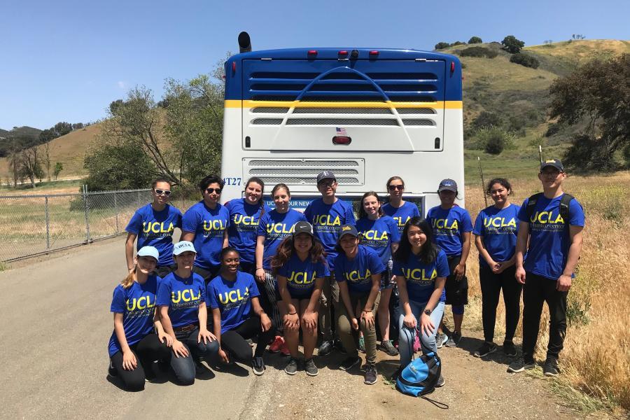 UCLA students volunteering at a one bus one cause event